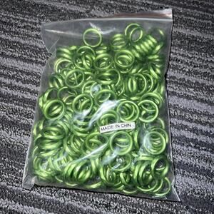 Green metallic plastic circles for jewelry, crafting and art projects